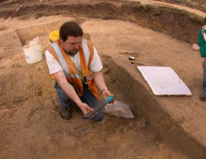 An AAS summer volunteer holds an artifact from the Gimbel Site. The Site Preservation and Security Committee administers the Arksite Preservation Fund program to help protect sites for future generations